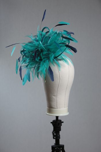 Ladies' formal Turquoise and Navy Blue medium feather and satin loop fascinator hat. Suitable for a wedding or ladies' day at the races